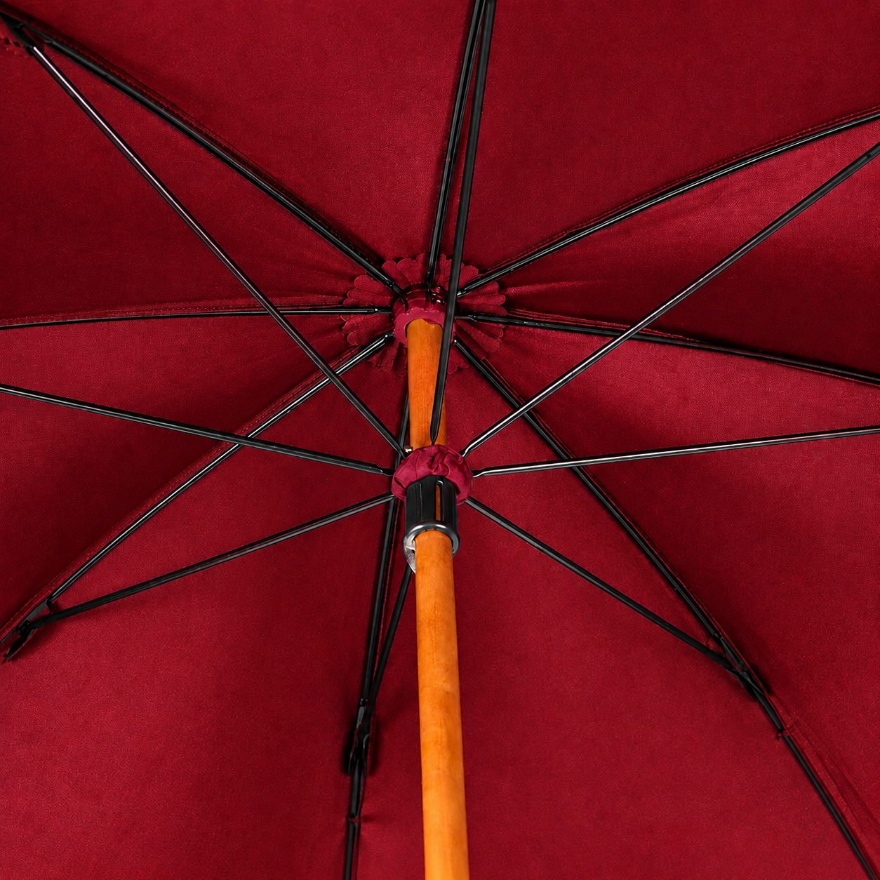 Integrated maple wood shaft and steel rib frame inside the umbrella