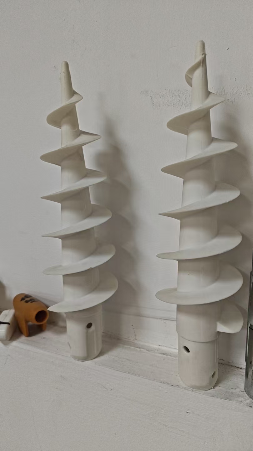 Spiral sand anchor accessory for securing a beach umbrella in sand