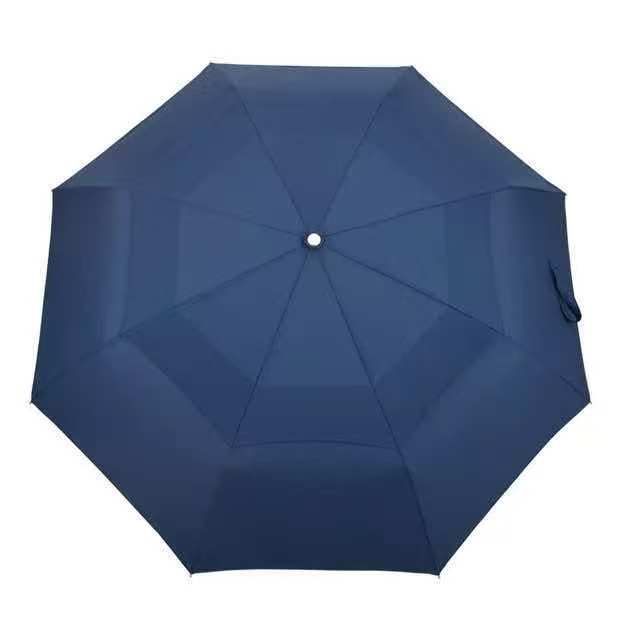 Top view of an open navy double-canopy automatic open-and-close umbrella showing overlapping canopy panels