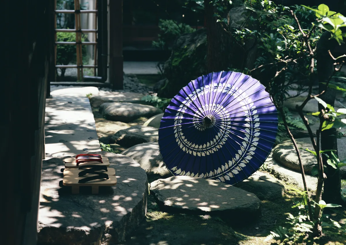 Japanese-style umbrella in a traditional garden setting