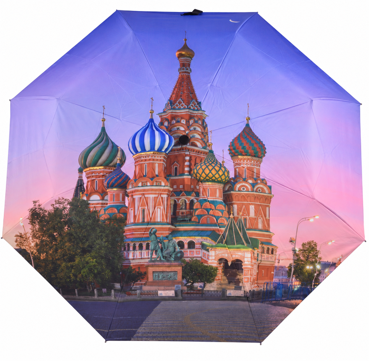 Open digitally printed umbrella with an architectural photograph crossing multiple canopy panel seams