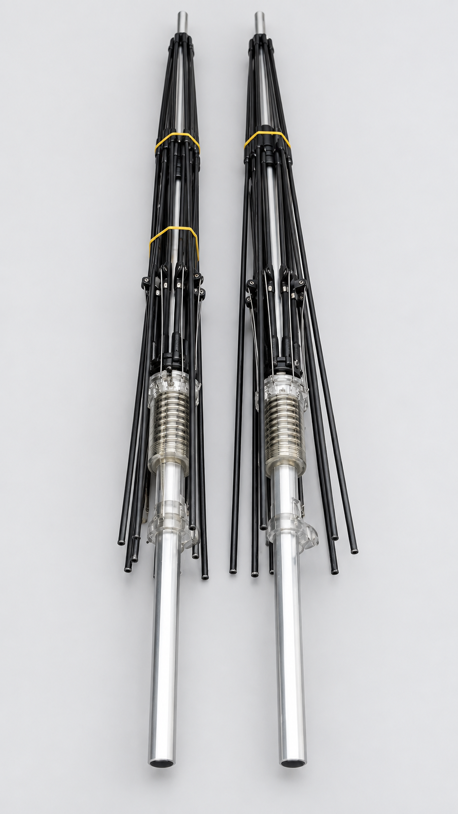 Two umbrella frames with black ribs and metal shafts on a white background